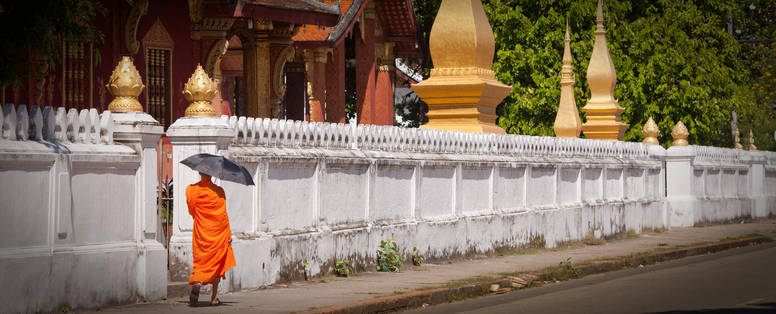 LAOS_-_Monk_walking_outside_Wat_Sensoukarahm_-_LP