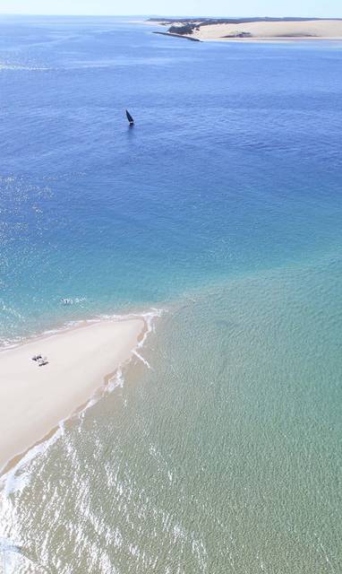 Azura_Benguerra_-_Aerial_view_of_North_Point_beach_picnic_with_dhow
