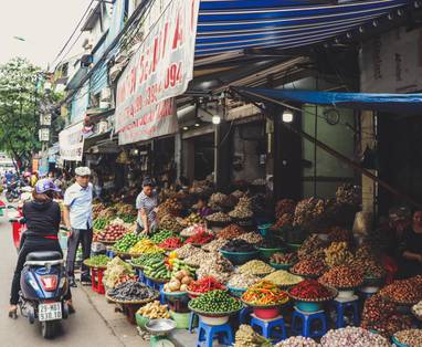 person-in-scooter-in-front-of-vegetables-2977435
