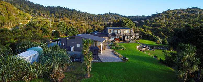NZ_Greymouth_Breakers_Breakers_overview_with_landscaped_gardens__green_house_and_native_bush