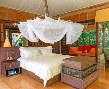 Slaapkamer bij Soneva Kiri op Koh Kood