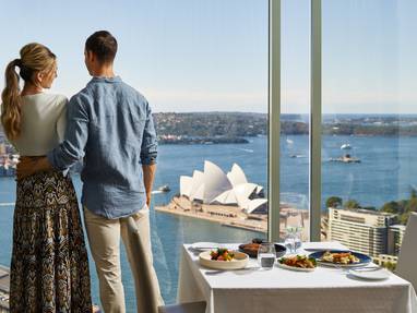 Sydney-SLSN_Couple_in_Altitude_restaurant_with_Opera_House_view