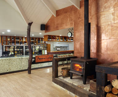Awaroa_Lodge_Main_Bar_and_Fireplace