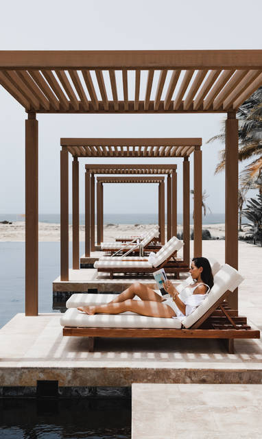 SLLAL-P0134-Woman-Reading-By-Pool